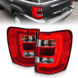 ANZO 311396 FITS: 1999-2004 Jeep Grand Cherokee LED Tail Lights w/ Light Bar Chrome Housing Red/Clear Lens Tail Lights