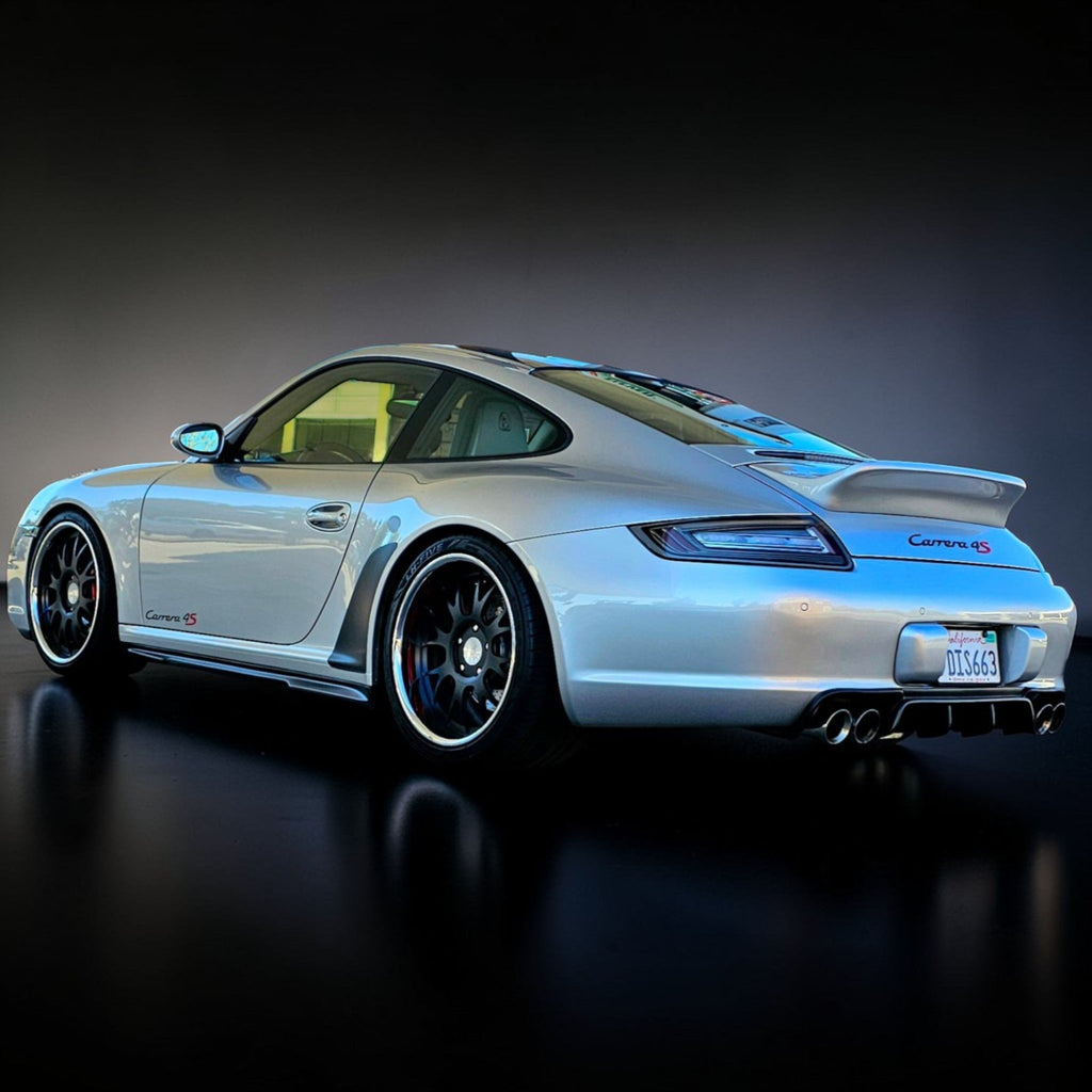 BetterBodies Motorsport polyurethane side skirts for narrow body Porsche 997 Carrera Mach II (2005–2012). Side view of the sleek skirts.