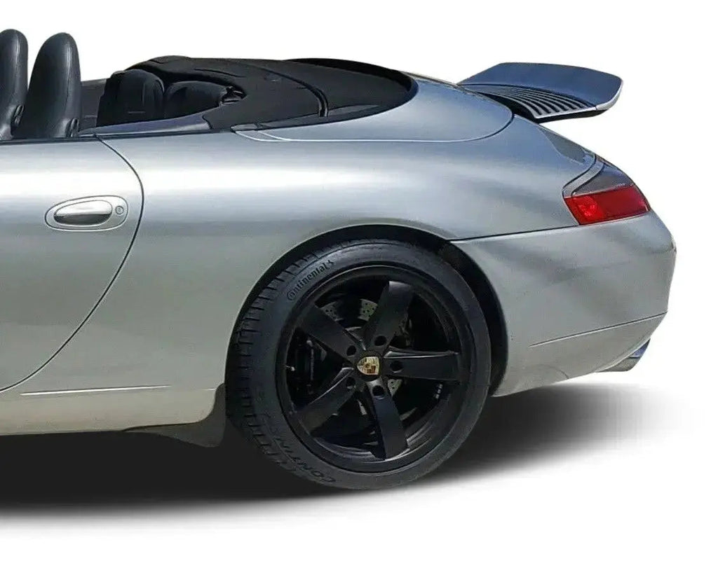 Silver polyurethane front lip and small ducktail spoiler for Porsche 996.1, upgrade from BetterBodies Motorsport, studio shot.
