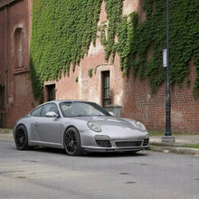 Load image into Gallery viewer, Silver Porsche 997.2 Aero Kit front lip and side rockers by BetterBodies Motorsport for 2009-2012 models.