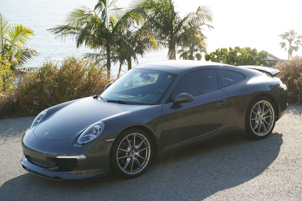Porsche 991 Carrera Euro GT chin spoiler front bumper splitter in polyurethane, black, installed on a 2012–2015 model.