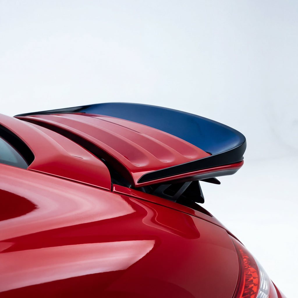 Porsche 997 Carrera GT3TEK rear wing polyurethane ducktail spoiler on a sports car, designed for improved aerodynamics and style.