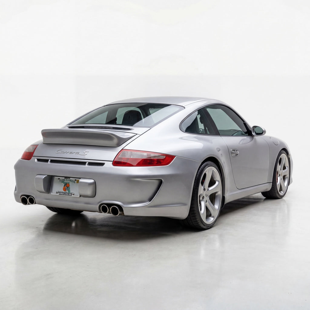 BetterBodies Motorsport Porsche 997.1 Carrera rear bumper in Aero racing style conversion, showing its sleek design and aerodynamic features.