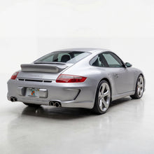 Load image into Gallery viewer, BetterBodies Motorsport Porsche 997.1 Carrera rear bumper in Aero racing style conversion, showing its sleek design and aerodynamic features.