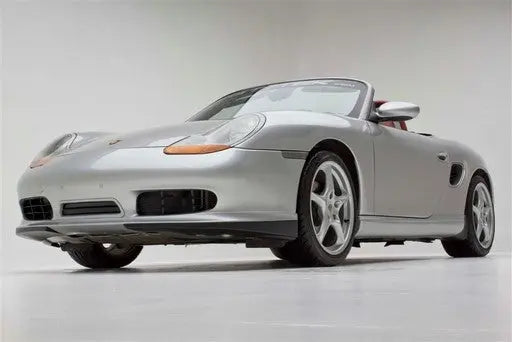 Polyurethane Porsche 986 Boxster Spyder style aero kit by BetterBodies Motorsport on a 1997-2004 sports car.