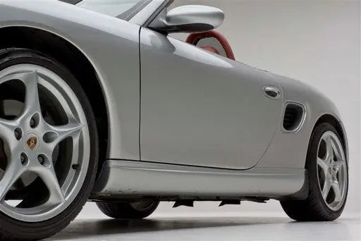 Porsche Boxster 1997–2004 with BetterBodies Motorsport Spyder style side rockers, polyurethane upgrade, visible side skirts and details.