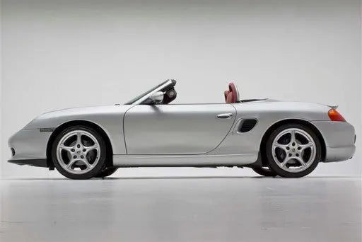 Porsche Boxster 1997–2004 with BetterBodies Motorsport Spyder Style Side Rockers in polyurethane finish, enhancing side profile.