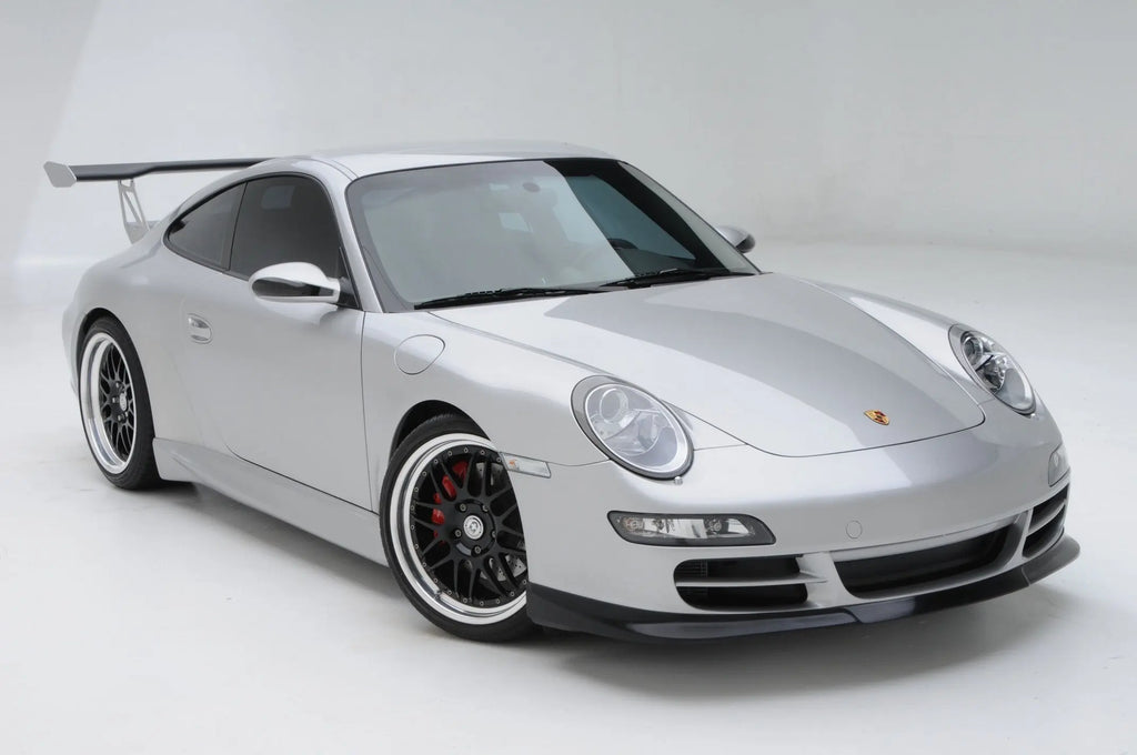 BetterBodies Motorsport polyurethane side skirts for Porsche 997 Carrera narrow body, 2005–2011, installed on car side profile.