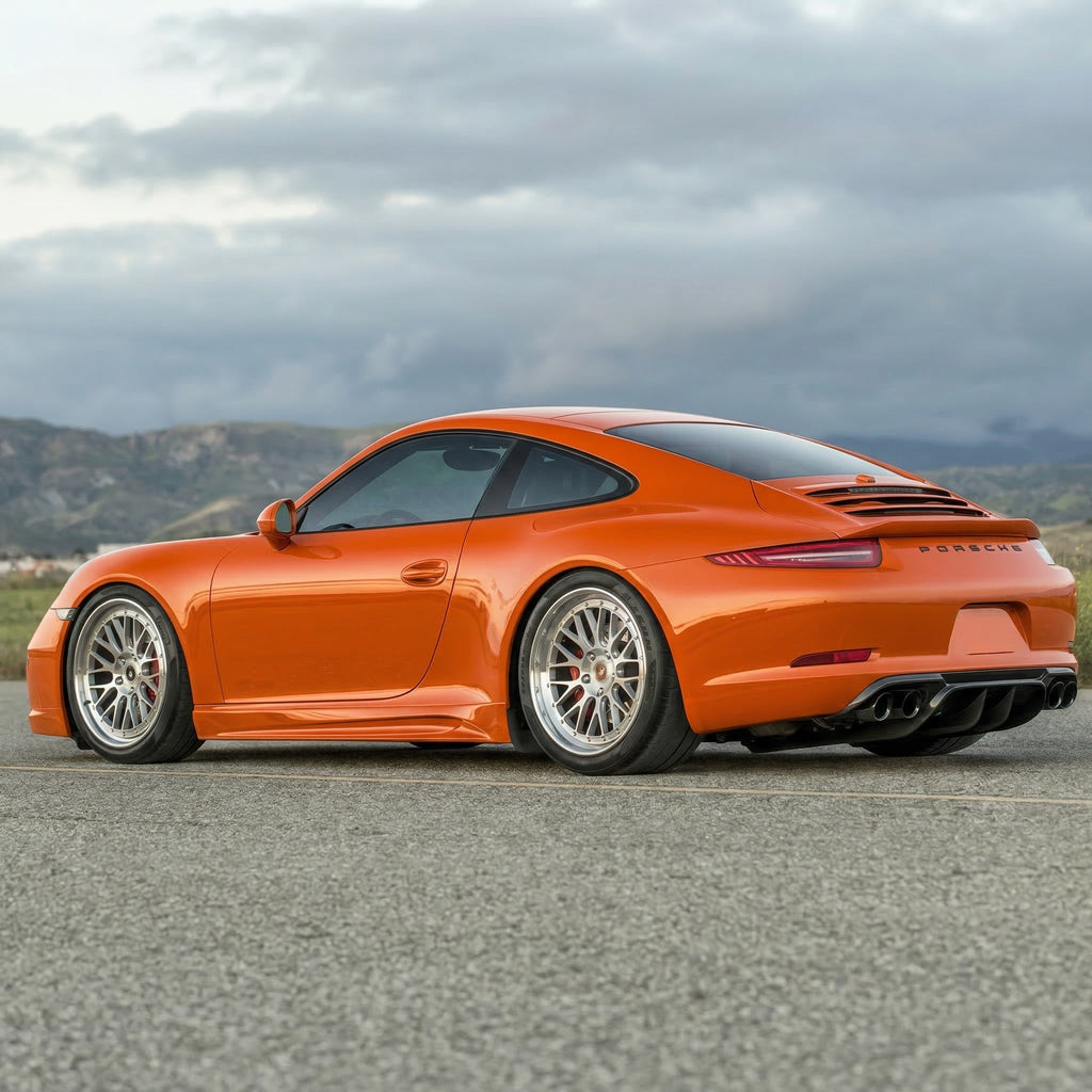 Orange Porsche 991.1 rear diffuser upgrade by BetterBodies Motorsport, made of polyurethane for aerodynamic enhancement.