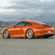 Load image into Gallery viewer, Orange Porsche 991.1 rear diffuser upgrade by BetterBodies Motorsport, made of polyurethane for aerodynamic enhancement.