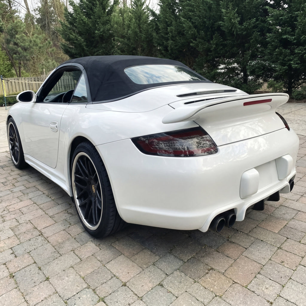 White Porsche 997.1 rear bumper diffuser in RUF TA-style polyurethane by BetterBodies Motorsport for 2005–2008 models.