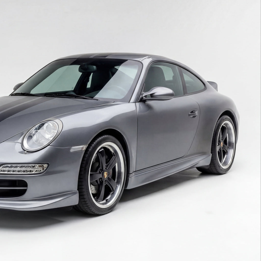 Porsche 997 Carrera narrow body side rockers by BetterBodies Motorsport featuring polyurethane aero skirts, installed on a 2005–2011 model.