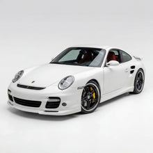 Load image into Gallery viewer, Polyurethane widebody front bumper lip for Porsche 997 Turbo, 2007–2009, by BetterBodies Motorsport, shown on a sleek car.