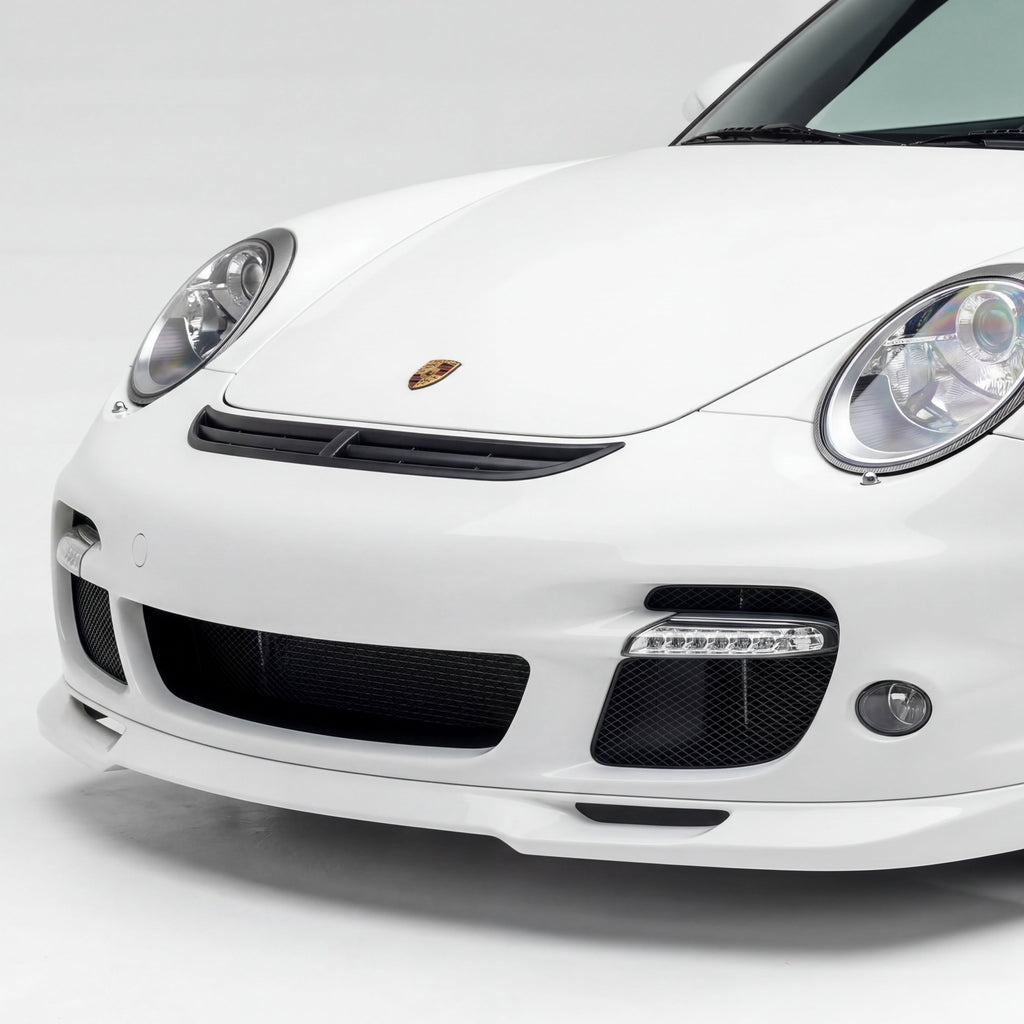 Polyurethane widebody front bumper lip for Porsche 997 Turbo (2007–2009) by BetterBodies Motorsport, shown on a sleek car.