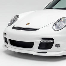 Load image into Gallery viewer, Polyurethane widebody front bumper lip for Porsche 997 Turbo (2007–2009) by BetterBodies Motorsport, shown on a sleek car.