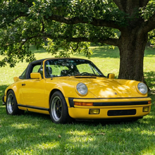 Load image into Gallery viewer, Yellow Porsche 911 RUF-style front spoiler by BetterBodies Motorsport, polyurethane narrow body design for classic 1974–1989 models.