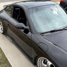 Load image into Gallery viewer, Polyurethane side skirts for Porsche 997 Carrera Mach II narrow body, 2005–2012, by BetterBodies Motorsport, shown on a transparent background.